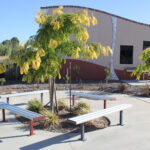 Bolt Down Benches powder coated in Colorbond Manor Red and Woodland Grey